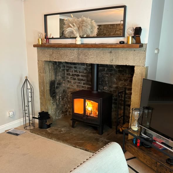 Halo Radial Wood Burning Stove in a Character Stone Fireplace