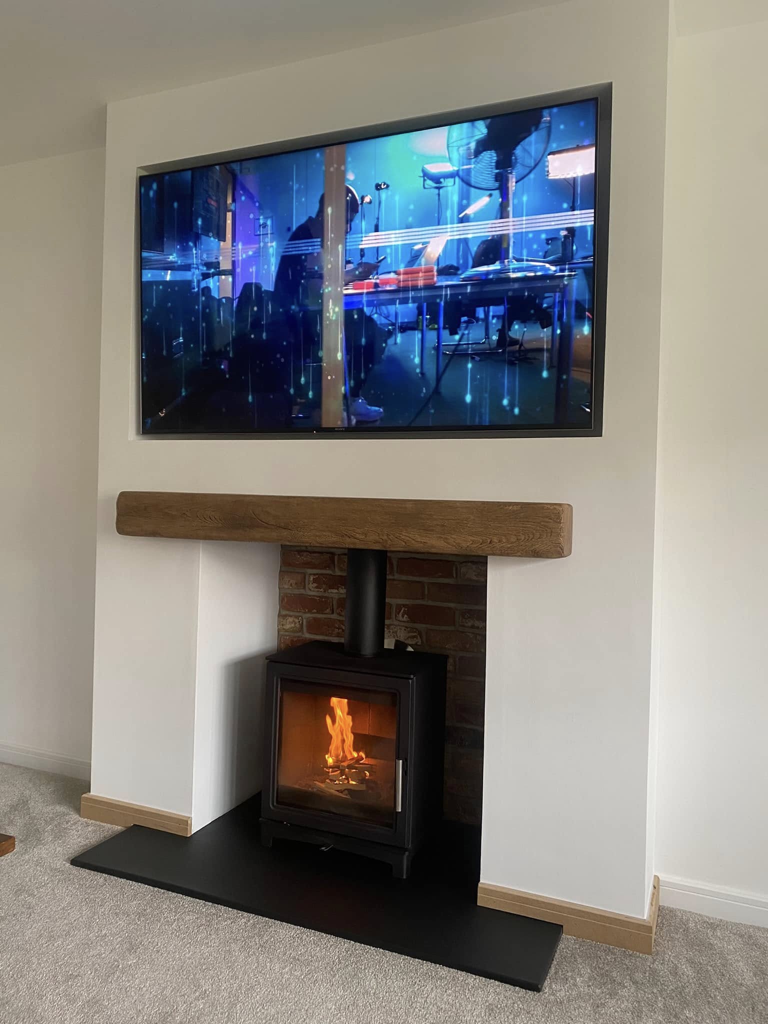 Feature Chimney Breast with Wood Burning Stove and Inset TV view 2