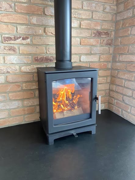 Summerhouse Stove Installation with Reclaimed Brick Heat Shield view 2