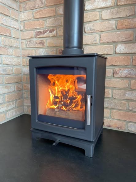 Summerhouse Stove Installation with Reclaimed Brick Heat Shield view 3