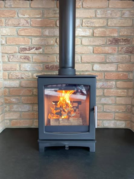 Summerhouse Stove Installation with Reclaimed Brick Heat Shield view 4