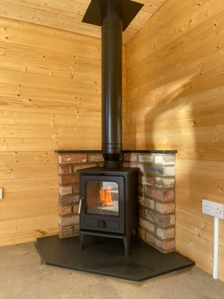 Summerhouse Stove Installation with Reclaimed Brick Heat Shield view 7