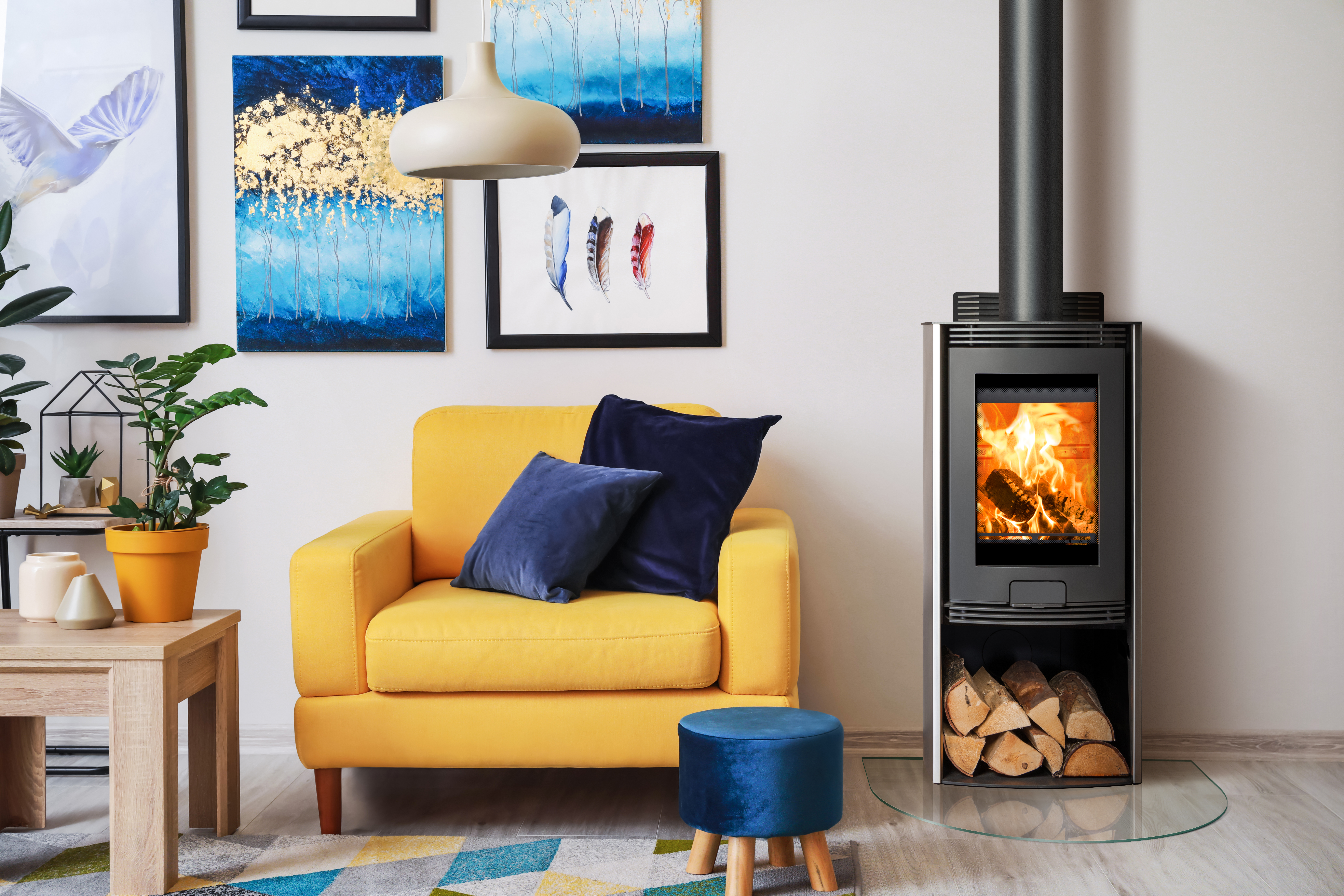 Di Lusso R4 Euro stove beside a yellow armchair