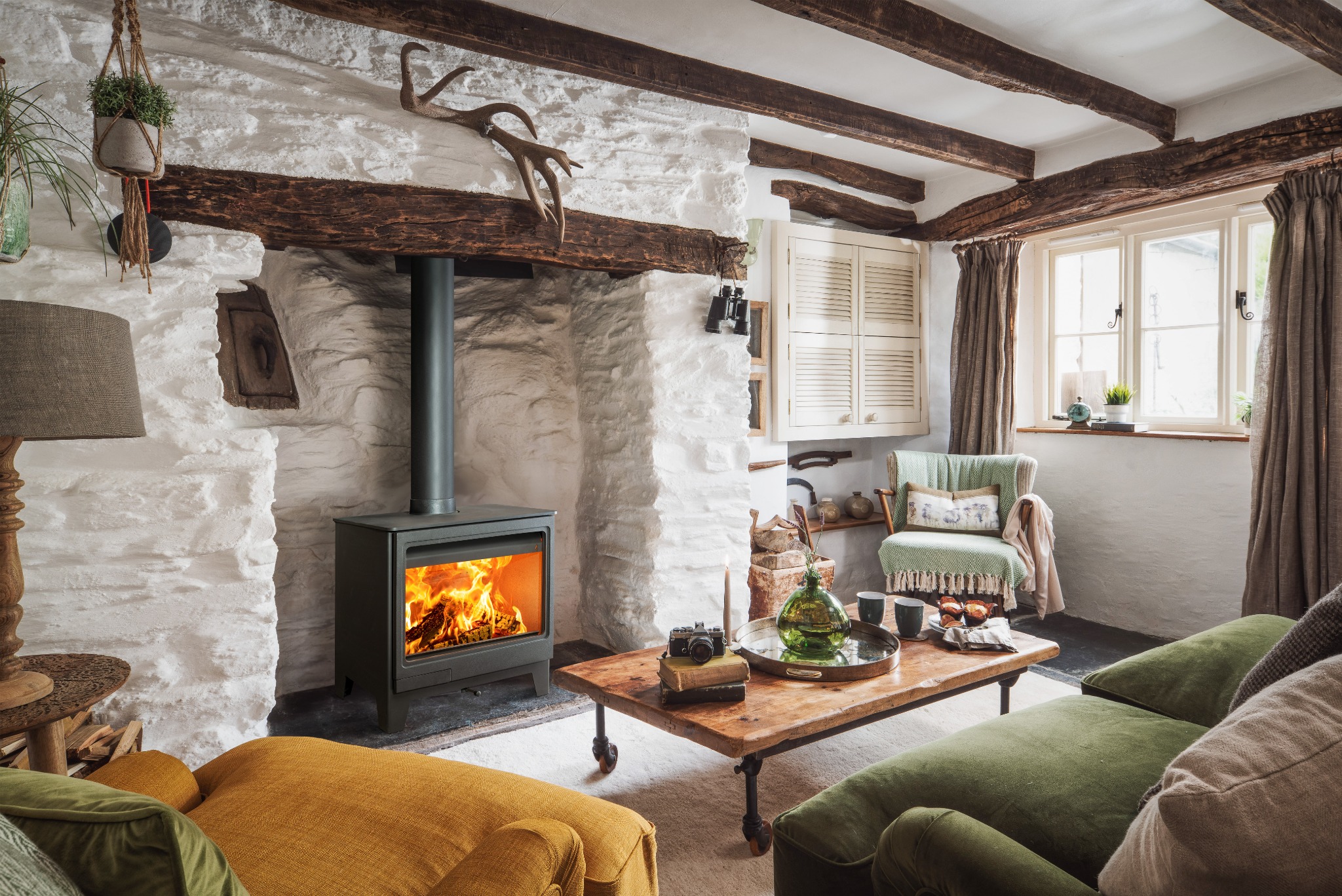 Wood burning stove set within a real living room setting